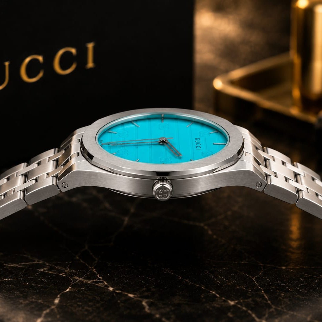Gucci Men's | Silver Stainless Steel | Turquoise GG Dial - VogueHourGucci Men's | Silver Stainless Steel | Turquoise GG Dial